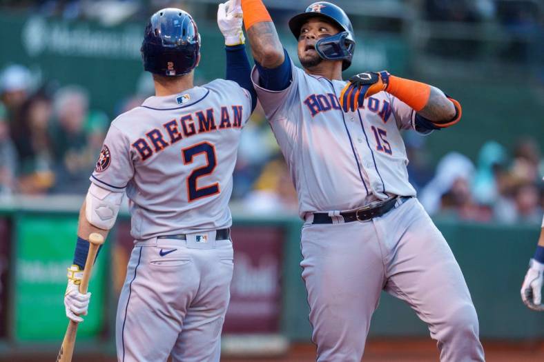 Jul 8, 2022; Oakland, California, USA;  Houston Astros catcher Martin Maldonado (15) celebrates with third baseman Alex Bregman (2) after hitting a home run against the Oakland Athletics during the fifth inning at RingCentral Coliseum. Mandatory Credit: Neville E. Guard-USA TODAY Sports