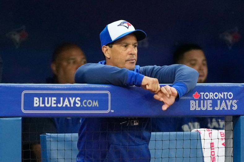 Jun 29, 2022; Toronto, Ontario, CAN; Toronto Blue Jays manager Charlie Montoyo (25) looks on from the dugout against the Boston Red Sox at Rogers Centre. Mandatory Credit: Kevin Sousa-USA TODAY Sports