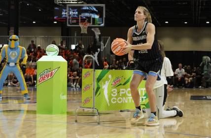 Jul 9, 2022; Chicago, Ill, USA; Allie Quigley shoots 3-point baskets during the 2022 WNBA All-Star Game skills competition at Wintrust Arena. Mandatory Credit: David Banks-USA TODAY Sports
