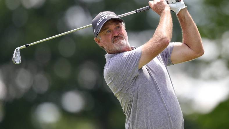 Jerry Kelly watches his shot down the fairway on the 15th hole during third round of the Bridgestone Senior Players Championship at Firestone Country Club on Saturday.

Bridgestone 3