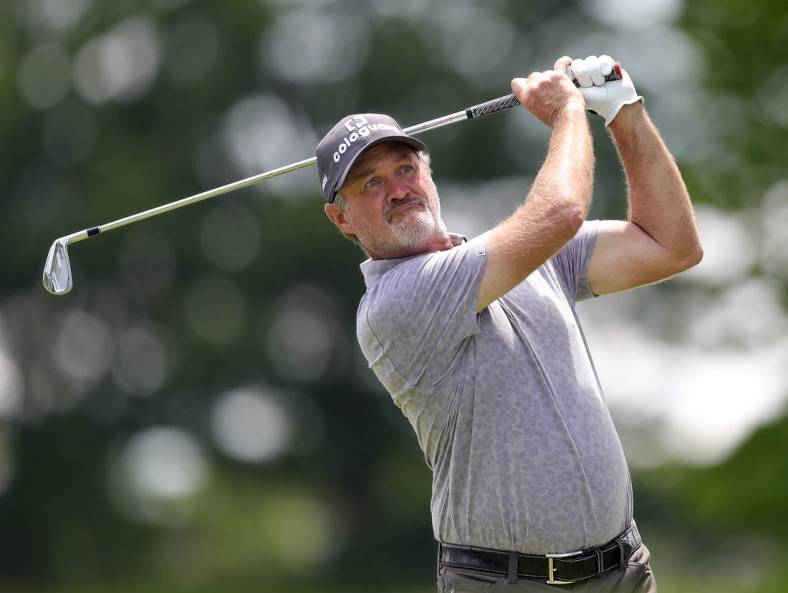 Jerry Kelly watches his shot down the fairway on the 15th hole during third round of the Bridgestone Senior Players Championship at Firestone Country Club on Saturday.

Bridgestone 3