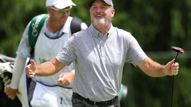 Jerry Kelly laughs as his putt fails to fall into the 15th hole during third round of the Bridgestone Senior Players Championship at Firestone Country Club on Saturday.

Bridgestone 4