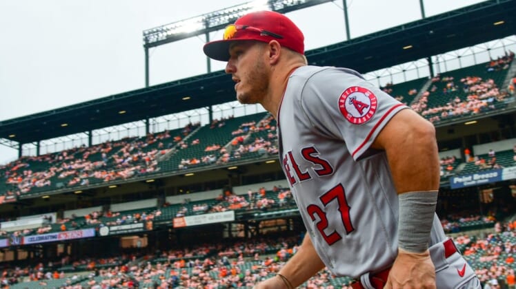 Jul 9, 2022; Baltimore, Maryland, USA;  Los Angeles Angels center fielder Mike Trout (27) runs on the the field before the game against the Baltimore Orioles at Oriole Park at Camden Yards. Mandatory Credit: Tommy Gilligan-USA TODAY Sports