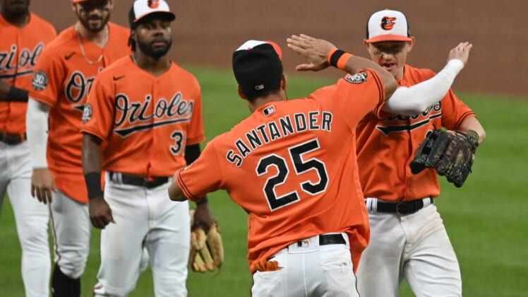 Jul 9, 2022; Baltimore, Maryland, USA;  Baltimore Orioles right fielder Anthony Santander (25) celebrates with  left fielder Austin Hays (21) and teammates after the game against the Los Angeles Angels at Oriole Park at Camden Yards. Mandatory Credit: Tommy Gilligan-USA TODAY Sports