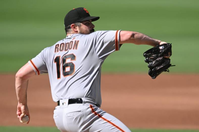 Jul 9, 2022; San Diego, California, USA; San Francisco Giants starting pitcher Carlos Rodon (16) throws a pitch against the San Diego Padres during the first inning at Petco Park. Mandatory Credit: Orlando Ramirez-USA TODAY Sports