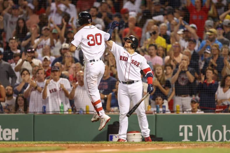 Jul 9, 2022; Boston, Massachusetts, USA; Boston Red Sox right fielder Rob Refsnyder (30) celebrates with Boston Red Sox first baseman Christian Vazquez (7) after hitting a home run during the sixth inning against the New York Yankees at Fenway Park. Mandatory Credit: Paul Rutherford-USA TODAY Sports