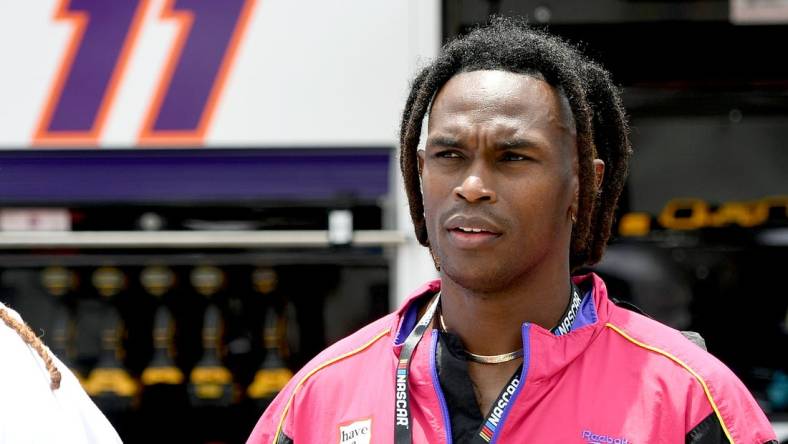 Jul 10, 2022; Hampton, Georgia, USA; Former Falcons receiver Julio Jones stands on the grid prior to the Quaker State 400 at Atlanta Motor Speedway. Mandatory Credit: Adam Hagy-USA TODAY Sports