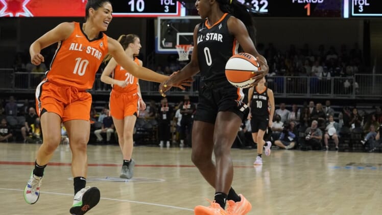 Jul 10, 2022; Chicago, Ill, USA; Team Wilson guard Kelsey Plum (10) defends Team Stewart guard Jackie Young (0) during the first half in a WNBA All Star Game at Wintrust Arena. Mandatory Credit: David Banks-USA TODAY Sports
