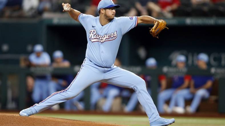 Jul 10, 2022; Arlington, Texas, USA; Texas Rangers starting pitcher Dane Dunning (33) throws a pitch against the Minnesota Twins in the first inning at Globe Life Field. Mandatory Credit: Tim Heitman-USA TODAY Sports