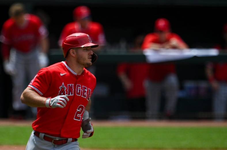 Jul 10, 2022; Baltimore, Maryland, USA;  Los Angeles Angels center fielder Mike Trout (27) runs out a eighth inning single against the Baltimore Orioles at Oriole Park at Camden Yards. Mandatory Credit: Tommy Gilligan-USA TODAY Sports