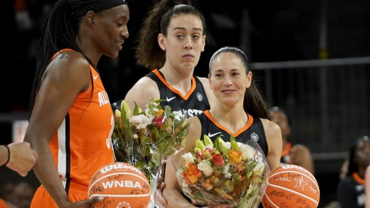 Jul 10, 2022; Chicago, Ill, USA; Team Stewart guard Sue Bird (right) and Team Wilson center Sylvia Fowles (left) are presented with flowers during the first half in a WNBA All Star Game at Wintrust Arena. Mandatory Credit: David Banks-USA TODAY Sports