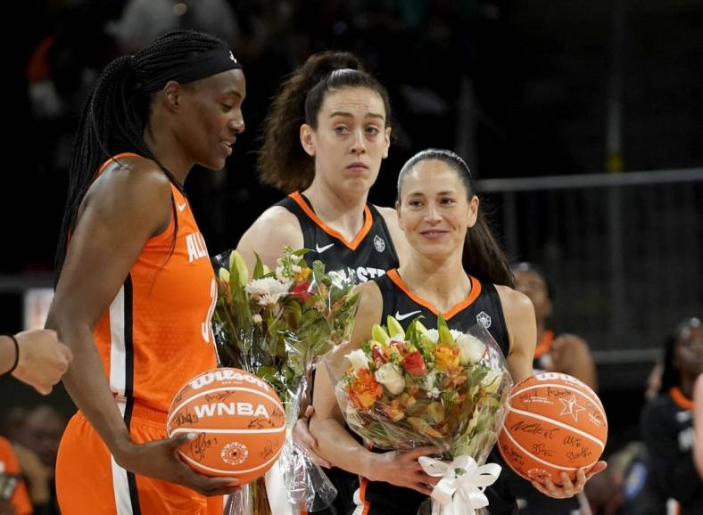 Jul 10, 2022; Chicago, Ill, USA; Team Stewart guard Sue Bird (right) and Team Wilson center Sylvia Fowles (left) are presented with flowers during the first half in a WNBA All Star Game at Wintrust Arena. Mandatory Credit: David Banks-USA TODAY Sports