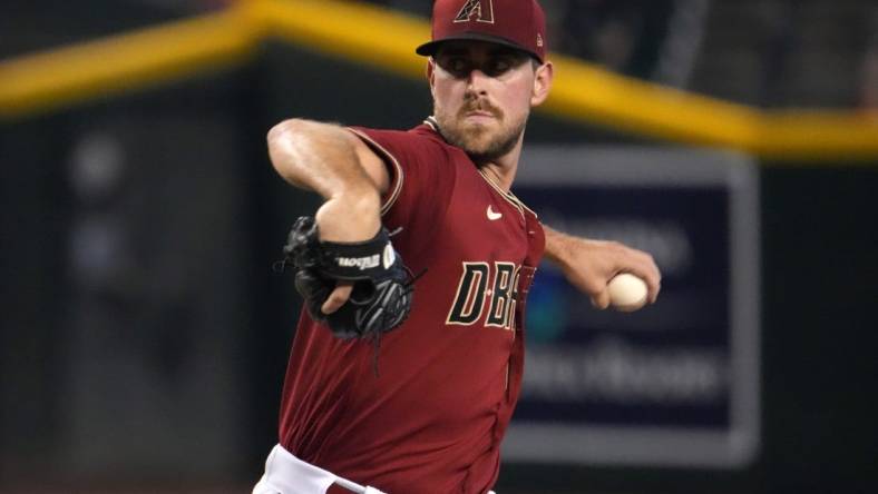 Jul 10, 2022; Phoenix, Arizona, USA; Arizona Diamondbacks starting pitcher Tyler Gilbert (49) pitches against the Colorado Rockies during the first inning at Chase Field. Mandatory Credit: Joe Camporeale-USA TODAY Sports