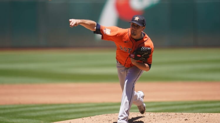 Jul 10, 2022; Oakland, California, USA; Houston Astros pitcher Jake Odorizzi (17) throws a pitch against the Oakland Athletics in the second inning at RingCentral Coliseum. Mandatory Credit: Cary Edmondson-USA TODAY Sports