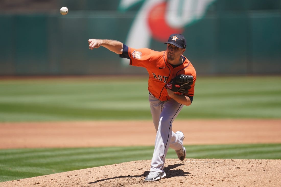 Jul 10, 2022; Oakland, California, USA; Houston Astros pitcher Jake Odorizzi (17) throws a pitch against the Oakland Athletics in the second inning at RingCentral Coliseum. Mandatory Credit: Cary Edmondson-USA TODAY Sports