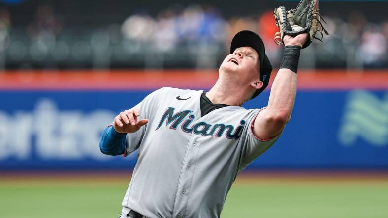 Jul 10, 2022; New York City, New York, USA; Miami Marlins first baseman Garrett Cooper (26) catches a fly ball for an out to end the sixth inning against the New York Mets at Citi Field. Mandatory Credit: Vincent Carchietta-USA TODAY Sports