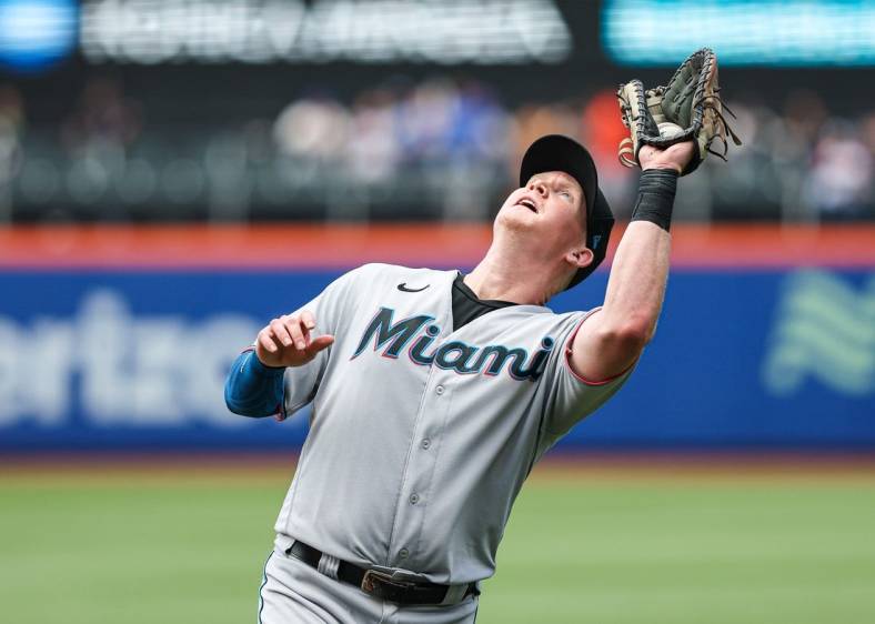 Jul 10, 2022; New York City, New York, USA; Miami Marlins first baseman Garrett Cooper (26) catches a fly ball for an out to end the sixth inning against the New York Mets at Citi Field. Mandatory Credit: Vincent Carchietta-USA TODAY Sports