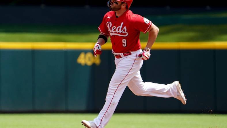 Cincinnati Reds first baseman Mike Moustakas (9) rounds the bases after hitting a three-run home during the third inning of a baseball game against the Tampa Bay Rays, Sunday, July 10, 2022, at Great American Ball Park in Cincinnati. The home run marked the 200th of his career.

Tampa Bay Rays At Cincinnati Reds July 10 0048