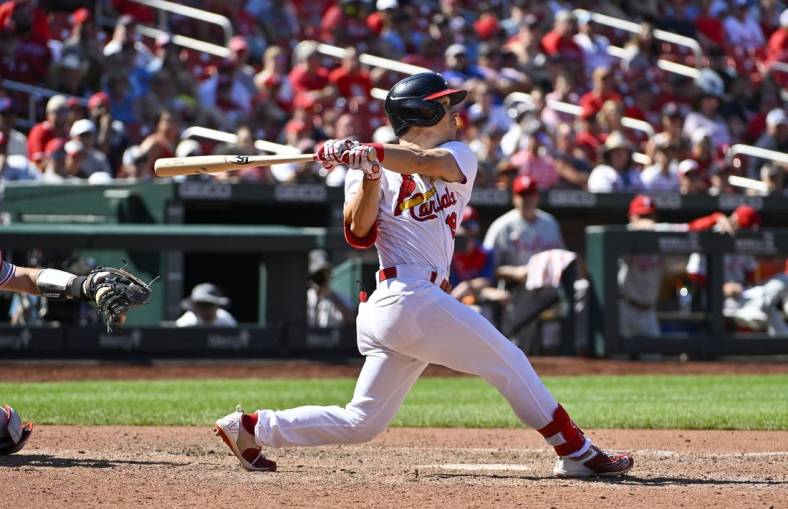 Jul 10, 2022; St. Louis, Missouri, USA;  St. Louis Cardinals shortstop Tommy Edman (19) hits a one run sacrifice fly against the Philadelphia Phillies during the eighth inning at Busch Stadium. Mandatory Credit: Jeff Curry-USA TODAY Sports