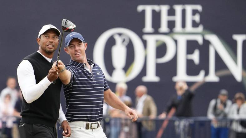 Jul 11, 2022; St. Andrews, SCT; Tiger Woods and Rory McIlroy during the R&A Celebration of Champions four-hole challenge at the 150th Open Championship golf tournament at St. Andrews Old Course. Mandatory Credit: Rob Schumacher-USA TODAY Sports