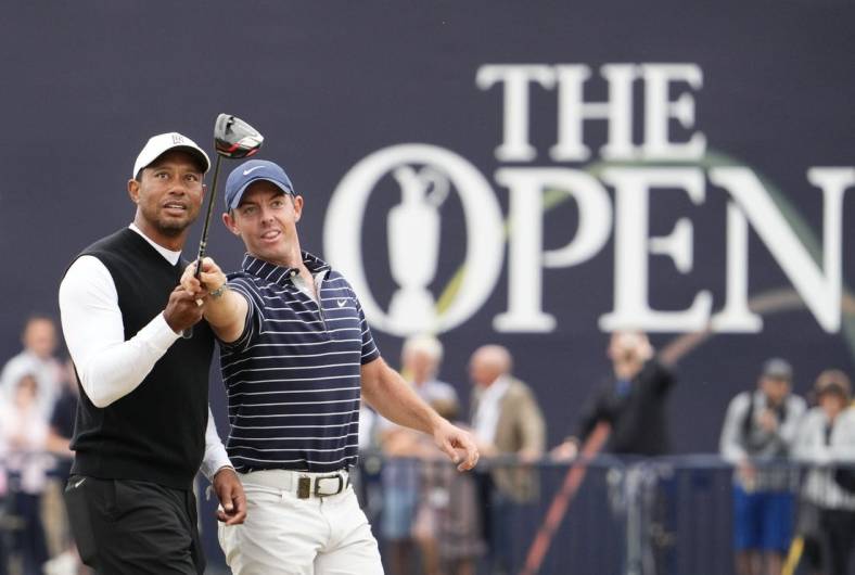 Jul 11, 2022; St. Andrews, SCT; Tiger Woods and Rory McIlroy during the R&A Celebration of Champions four-hole challenge at the 150th Open Championship golf tournament at St. Andrews Old Course. Mandatory Credit: Rob Schumacher-USA TODAY Sports