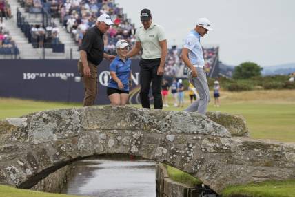 Jul 11, 2022; St. Andrews, Fife, SCT; Mark O'meara (left) Jennifer Sraga (center left) Henrik Stenson and Aaron Jarvis on the Swilcan Bridge on the 18th fairway during the Celebration of Champions at the 150th Open Championship golf tournament at St. Andrews Old Course. Mandatory Credit: Michael Madrid-USA TODAY Sports