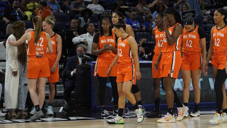 Jul 10, 2022; Chicago, Ill, USA; Players wear the number 42 to honor Brittany Griner as they greet Cherelle Griner (left) Brittany   s spouse during the second half in a WNBA All Star Game at Wintrust Arena. Mandatory Credit: David Banks-USA TODAY Sports