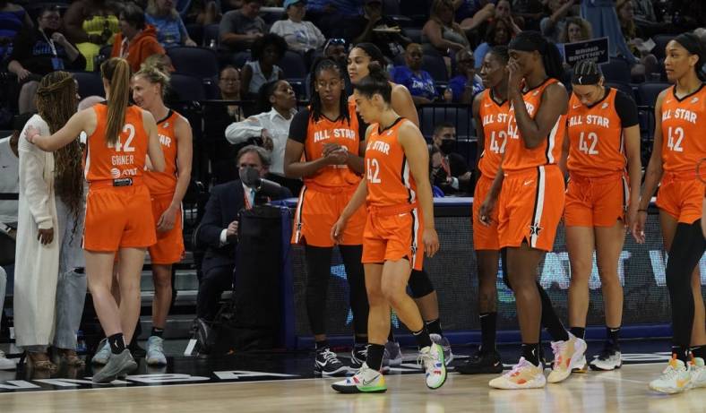 Jul 10, 2022; Chicago, Ill, USA; Players wear the number 42 to honor Brittany Griner as they greet Cherelle Griner (left) Brittany   s spouse during the second half in a WNBA All Star Game at Wintrust Arena. Mandatory Credit: David Banks-USA TODAY Sports