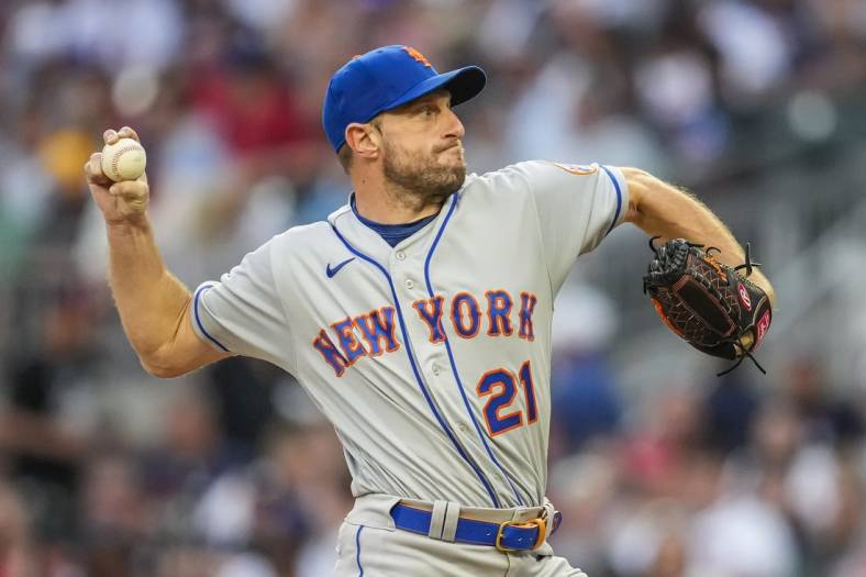 Jul 11, 2022; Cumberland, Georgia, USA; New York Mets starting pitcher Max Scherzer (21) pitches against the Atlanta Braves during the third inning at Truist Park. Mandatory Credit: Dale Zanine-USA TODAY Sports