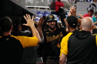 Jul 11, 2022; Miami, Florida, USA; Pittsburgh Pirates center fielder Jake Marisnick (41) celebrates with teammates in the dugout after hitting a two-run home run in the ninth inning against the Miami Marlins at loanDepot park. Mandatory Credit: Jasen Vinlove-USA TODAY Sports
