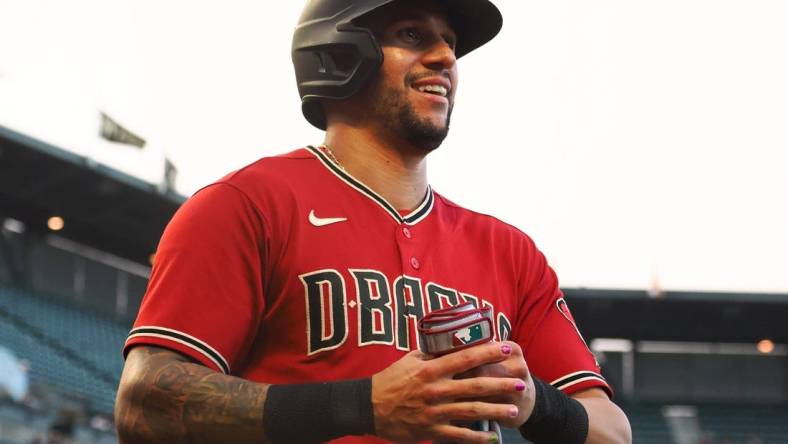 Jul 11, 2022; San Francisco, California, USA; Arizona Diamondbacks left fielder David Peralta (6) smiles after scoring a run against the San Francisco Giants during the third inning at Oracle Park. Mandatory Credit: Kelley L Cox-USA TODAY Sports