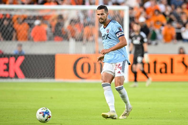 Jul 9, 2022; Houston, Texas, USA; FC Dallas defender Matt Hedges (24) passes the ball during the first half against the Houston Dynamo FC at PNC Stadium. Mandatory Credit: Maria Lysaker-Houston Dynamo FC-USA TODAY Sports