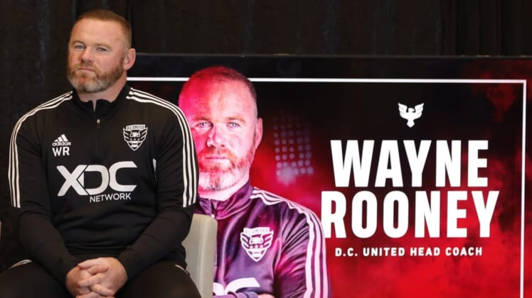 Jul 12, 2022; Washington, DC, USA; D.C. United new head coach Wayne Rooney listens at an introductory press conference at Audi Field. Mandatory Credit: Geoff Burke-USA TODAY Sports