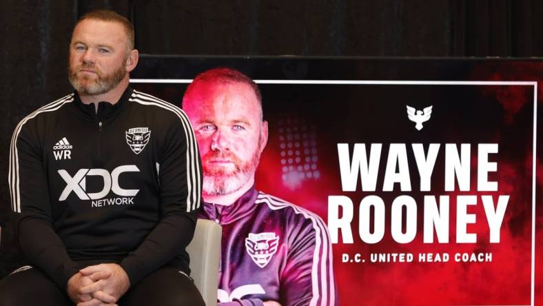 Jul 12, 2022; Washington, DC, USA; D.C. United new head coach Wayne Rooney listens at an introductory press conference at Audi Field. Mandatory Credit: Geoff Burke-USA TODAY Sports