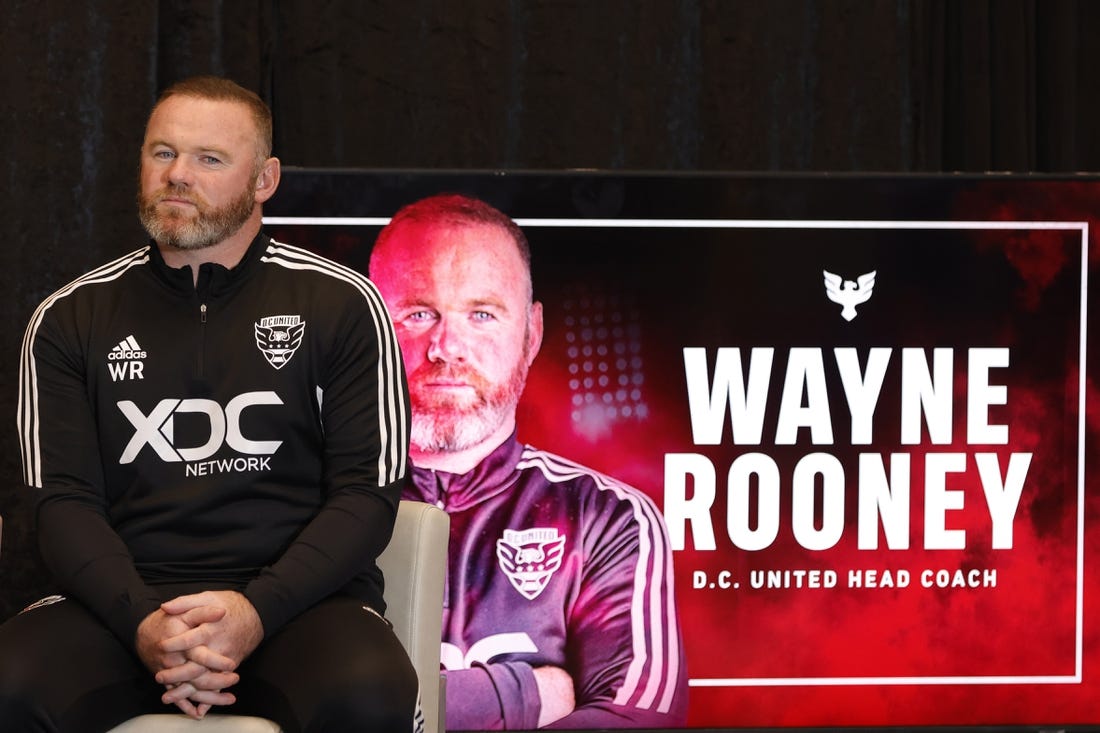 Jul 12, 2022; Washington, DC, USA; D.C. United new head coach Wayne Rooney listens at an introductory press conference at Audi Field. Mandatory Credit: Geoff Burke-USA TODAY Sports