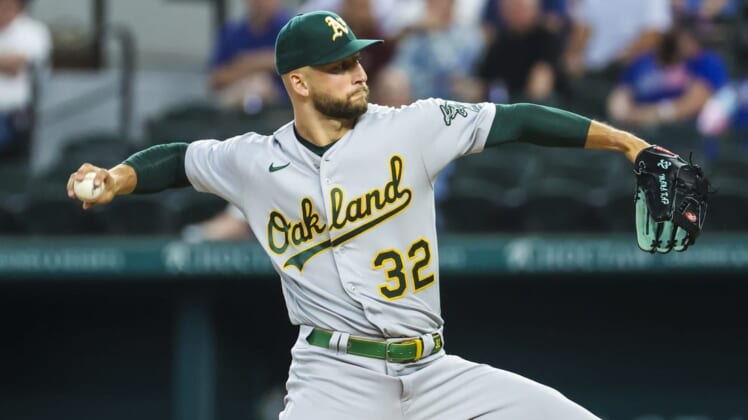 Jul 12, 2022; Arlington, Texas, USA; Oakland Athletics starting pitcher James Kaprielian (32) throws during the first inning against the Texas Rangers at Globe Life Field. Mandatory Credit: Kevin Jairaj-USA TODAY Sports