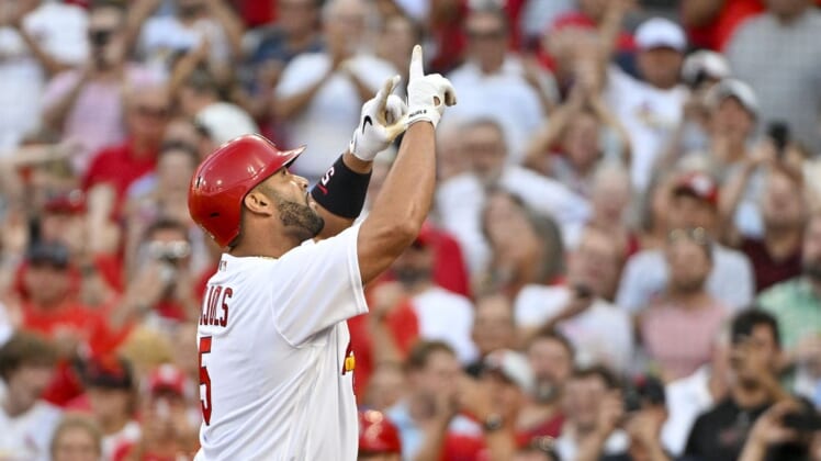 Jul 12, 2022; St. Louis, Missouri, USA;  St. Louis Cardinals designated hitter Albert Pujols (5) reacts after hitting a solo home run against the Los Angeles Dodgers during the second inning at Busch Stadium. Mandatory Credit: Jeff Curry-USA TODAY Sports