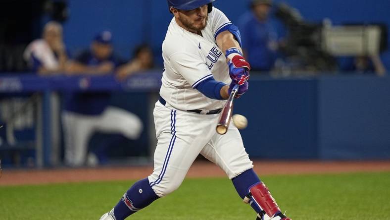 Jul 12, 2022; Toronto, Ontario, CAN; Toronto Blue Jays designated hitter Alejandro Kirk (30) hits a single against the Philadelphia Phillies during the sixth inning at Rogers Centre. Mandatory Credit: John E. Sokolowski-USA TODAY Sports