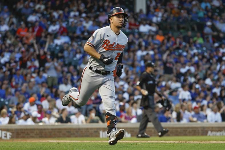 Jul 12, 2022; Chicago, Illinois, USA; Baltimore Orioles third baseman Ramon Urias (29) smiles as he rounds the bases after hitting a two-run home run against the Chicago Cubs during the fourth inning at Wrigley Field. Mandatory Credit: Kamil Krzaczynski-USA TODAY Sports