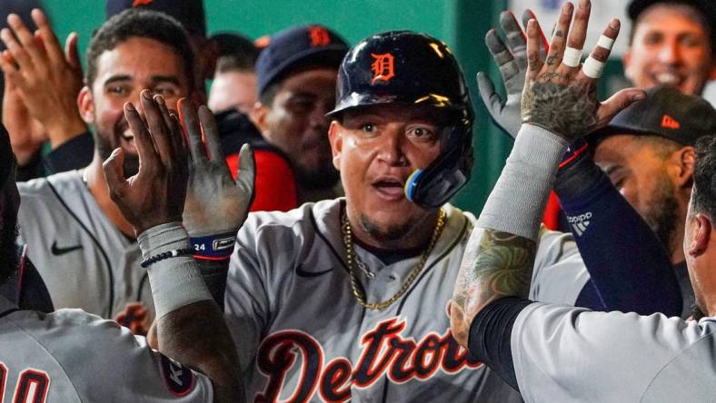 Jul 12, 2022; Kansas City, Missouri, USA; Detroit Tigers designated hitter Miguel Cabrera (24) is congratulated in the dugout against the Kansas City Royals after scoring in the seventh inning at Kauffman Stadium. Mandatory Credit: Denny Medley-USA TODAY Sports