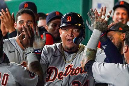 Jul 12, 2022; Kansas City, Missouri, USA; Detroit Tigers designated hitter Miguel Cabrera (24) is congratulated in the dugout against the Kansas City Royals after scoring in the seventh inning at Kauffman Stadium. Mandatory Credit: Denny Medley-USA TODAY Sports