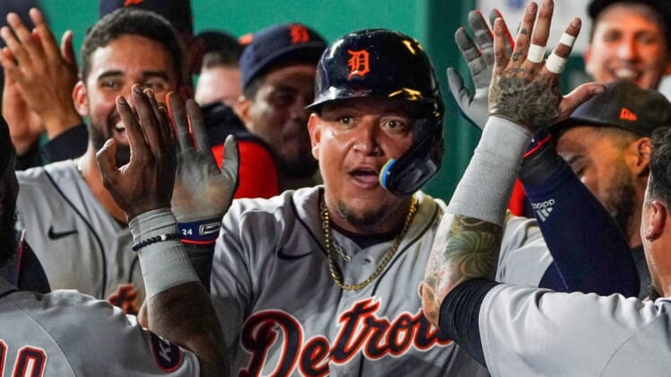 Jul 12, 2022; Kansas City, Missouri, USA; Detroit Tigers designated hitter Miguel Cabrera (24) is congratulated in the dugout against the Kansas City Royals after scoring in the seventh inning at Kauffman Stadium. Mandatory Credit: Denny Medley-USA TODAY Sports