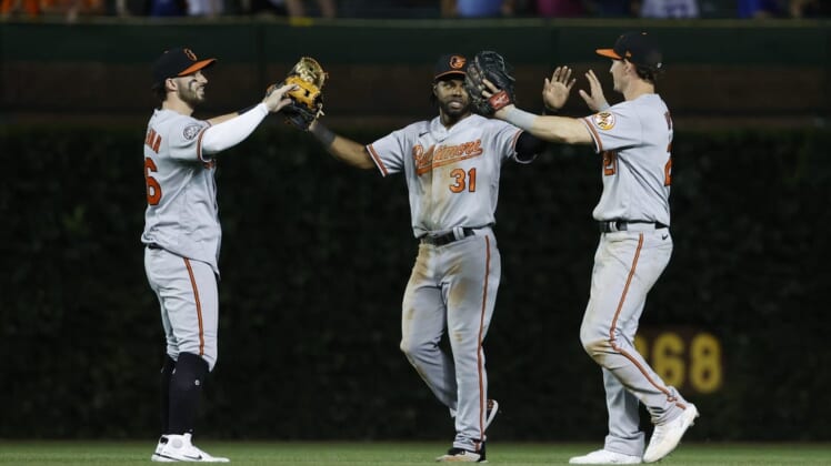 Jul 12, 2022; Chicago, Illinois, USA; Baltimore Orioles players celebrate teams win against the Chicago Cubs at Wrigley Field. Mandatory Credit: Kamil Krzaczynski-USA TODAY Sports