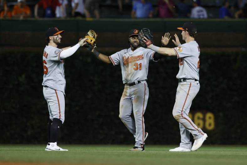 Jul 12, 2022; Chicago, Illinois, USA; Baltimore Orioles players celebrate teams win against the Chicago Cubs at Wrigley Field. Mandatory Credit: Kamil Krzaczynski-USA TODAY Sports