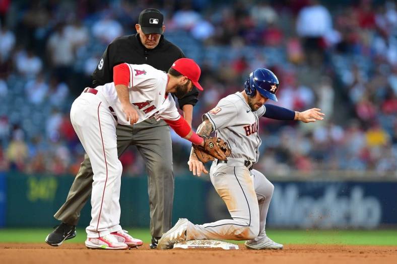 Jul 12, 2022; Anaheim, California, USA; Houston Astros designated hitter J.J. Matijevic (13) steals second against Los Angeles Angels second baseman Michael Stefanic (38) during the fourth inning at Angel Stadium. Mandatory Credit: Gary A. Vasquez-USA TODAY Sports