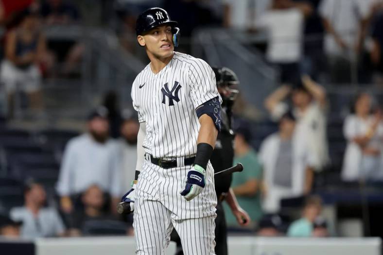 Jul 12, 2022; Bronx, New York, USA; New York Yankees pinch hitter Aaron Judge (99) reacts after striking out during the ninth inning against the Cincinnati Reds at Yankee Stadium. Mandatory Credit: Brad Penner-USA TODAY Sports