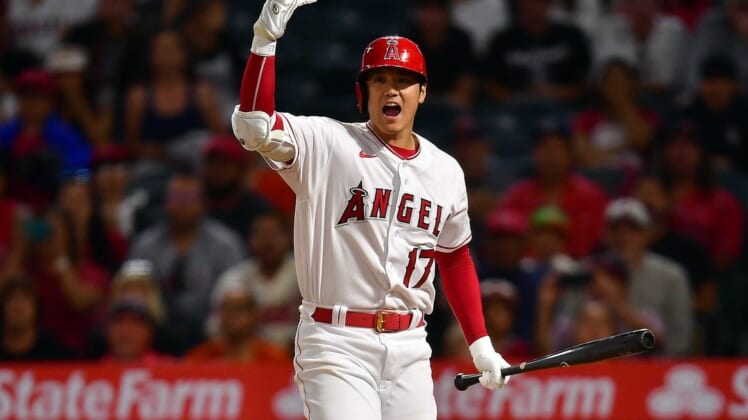 Jul 12, 2022; Anaheim, California, USA; Los Angeles Angels designated hitter Shohei Ohtani (17) signals for left fielder Brandon Marsh (16) to score after Houston Astros relief pitcher Rafael Montero (47) throws a passed ball during the seventh inning at Angel Stadium. Mandatory Credit: Gary A. Vasquez-USA TODAY Sports