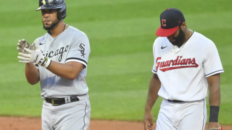 Jul 13, 2022; Cleveland, Ohio, USA; Chicago White Sox first baseman Jose Abreu (79) celebrates his RBI double beside Cleveland Guardians shortstop Amed Rosario (1) in the sixth inning at Progressive Field. Mandatory Credit: David Richard-USA TODAY Sports