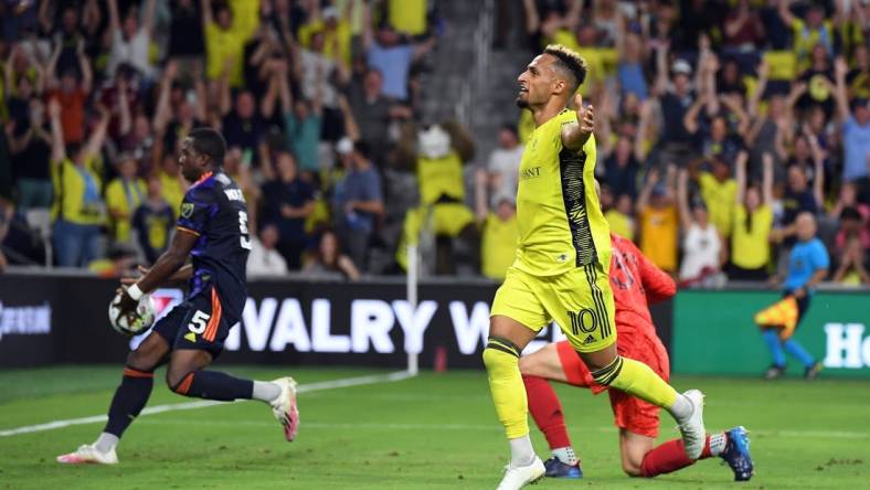 Jul 13, 2022; Nashville, Tennessee, USA; Nashville SC midfielder Hany Mukhtar (10) celebrates after a goal during the first half against the Seattle Sounders at GEODIS Park. Mandatory Credit: Christopher Hanewinckel-USA TODAY Sports