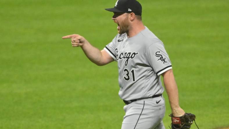 Jul 13, 2022; Cleveland, Ohio, USA; Chicago White Sox relief pitcher Liam Hendriks (31) celebrates a win over the Cleveland Guardians at Progressive Field. Mandatory Credit: David Richard-USA TODAY Sports